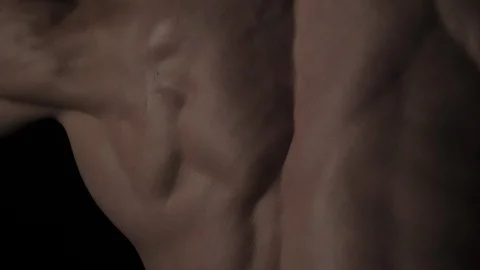 Muscular Man Bodybuilder. Man Posing On A Black Background, Shows His Muscles Video stock 128346258