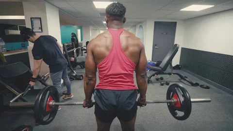 Muscular man doing deadlift exercise in the gym wide angke Stock Footage 89577244