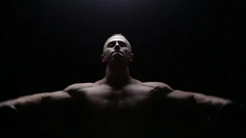 Muscular man doing lateral raise Stock Footage 76168165