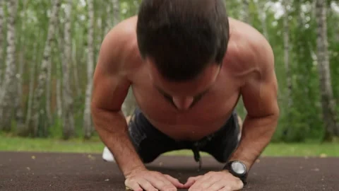 Muscular Man Doing Outdoor Push-up Workout Video stock 329599174