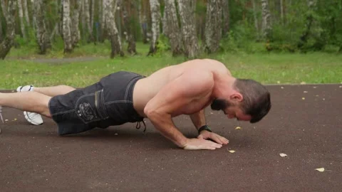 Muscular Man Doing Push-ups Outdoors Video stock 329599173
