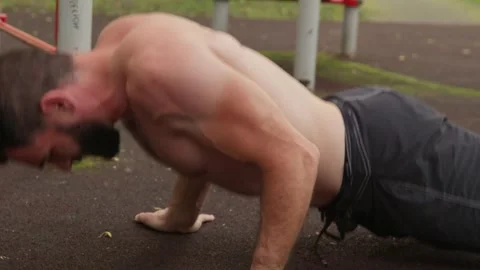 Muscular Man Doing Push-ups Outdoors Video stock 330044281