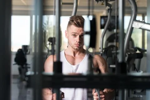 Muscular Man Exercising Back Stock Photos