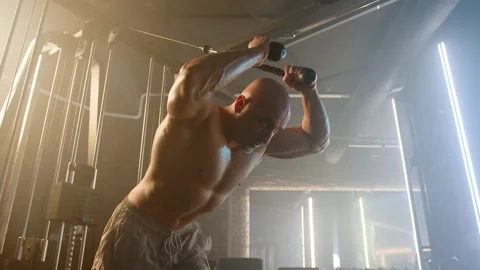 Muscular Man Exercising on Crossover Machine for Strong Back Muscles Stock Footage 269212808