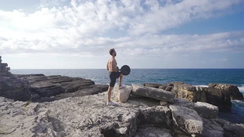 Muscular man exercising. Stock Footage 212506878