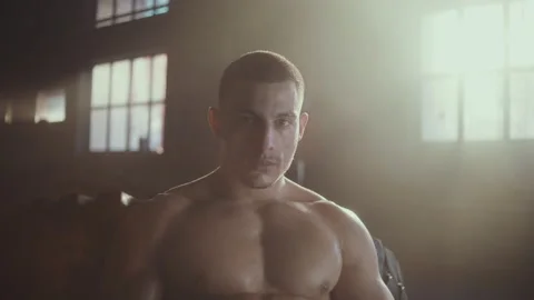 Muscular man looking at camera Stock Footage 236181630
