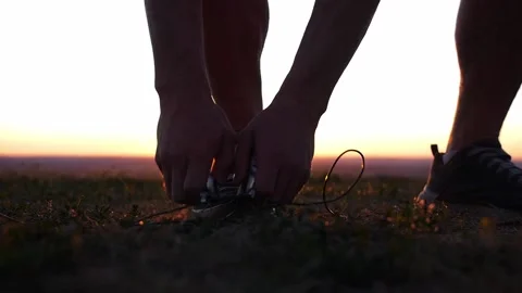 A muscular man picks up a jump rope from the ground Stock Footage 219956231