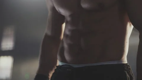 Muscular man posing on camera Stock Footage 236181956