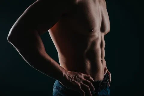 Muscular man posing in the studio Stock Photos