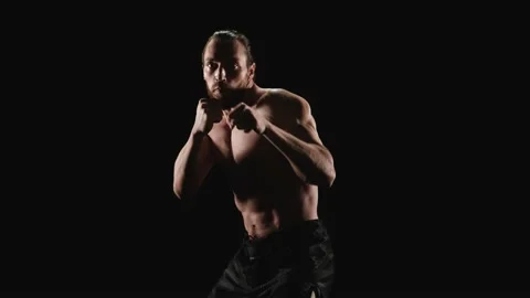 Muscular man practicing shadow boxing Stock Footage 151596191