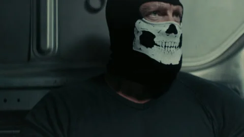 Muscular man with skull mask in a van | Stock Video | Pond5