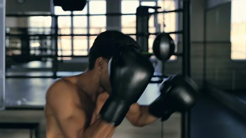 Muscular man training in box. Hitting boxing bunch at the gym. Stock Footage 98680368