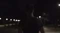 The muscular man walking in a dark street. slow motion 4k or 4k+ Resolution