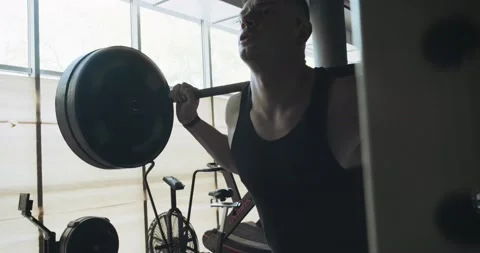 Muscular men doing barbell back squatting. Intense strength cardio training Video stock 130219839