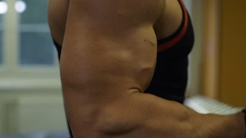 Muscular Men Exercise With Weights. Bodybuilder Doing Bicep Dumbbell Curls Stock Footage 121272218