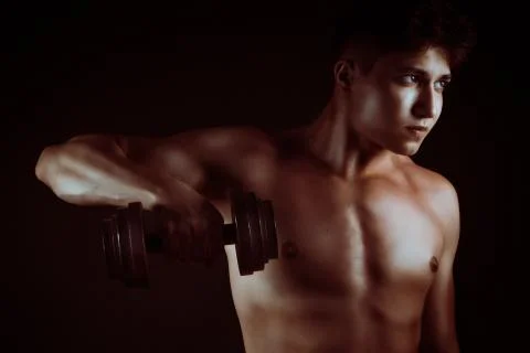 Musculed model posing in studio Stock Photos