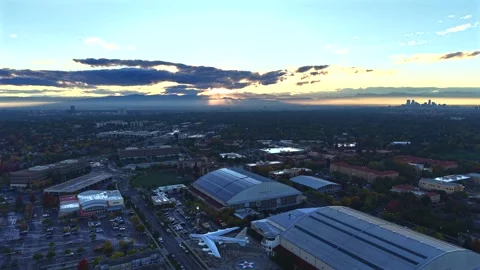 Museum Below, City Beyond — A Sweeping High Pull Out Over Denver at Dusk Stock Footage 340505530