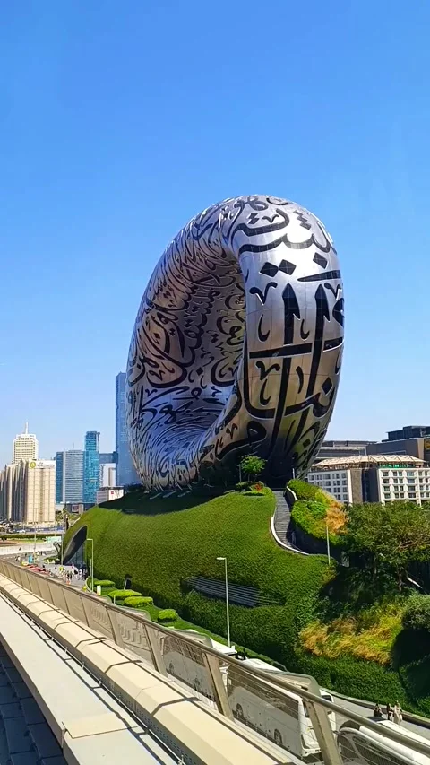 Museum of the Future building seen from metro train in Dubai 스톡 동영상 320458872
