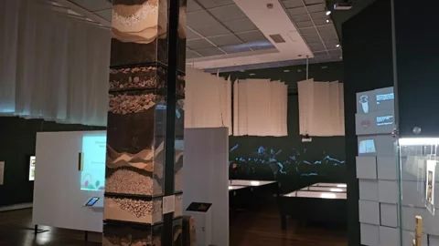 Museum Hall with Soil Layers Column and Hanging Panels, Colombia 8K Stock Footage 331514507