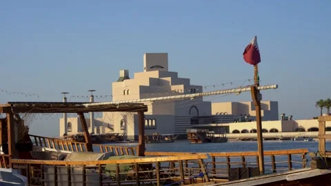 The Museum of Islamic Art and Qatari Flag in Doha Stock Footage 336563932
