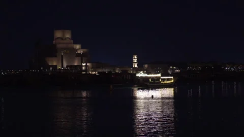 Museum of Islamic Art Night View with Illuminated Traditional Dhow Boat Stock Footage 333632413