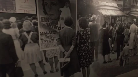 A museum wall display shows archival imagery and period street scenes in Poland Stock Footage 337005505
