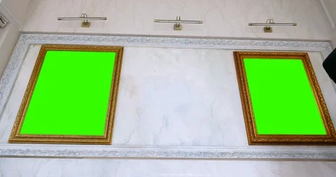 Museum workers hanging a picture in hall after restoration Stock Footage