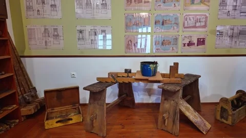 A museum workshop display shows traditional carpentry tools and artifacts Stock Footage 336505657