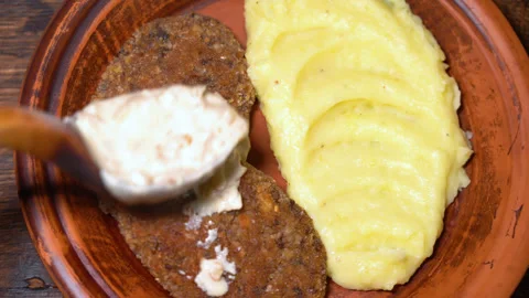 Mushroom cutlets with mashed potatoes on a plate Stock Footage 252747056