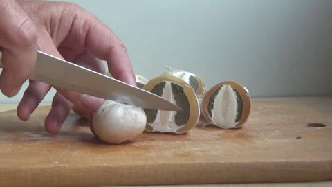 Mushroom in the egg stage Phallus impudicus, cutting the mushroom, Ukraine. Stock Footage 313558586