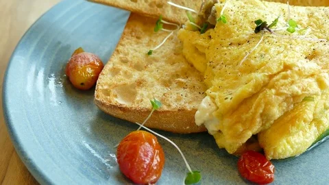 Mushroom omelette with tomato Stock Footage 78940660
