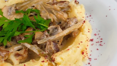 Mushroom stroganoff, close-up view, with meat and mashed potato Stock Footage 95149495