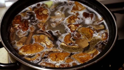Mushrooms are cooked in a pan in the kitchen. Stock Footage 102721439