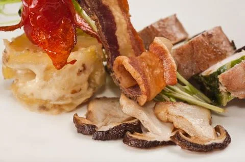 Mushrooms with bacon Stock Photos