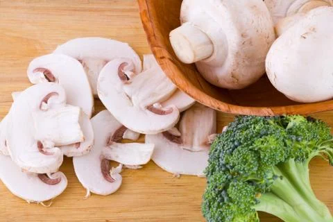 Mushrooms, broccoli Stock Photos