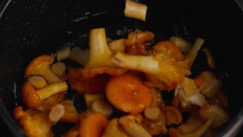Mushrooms fall into the pot Stock Footage 326907226
