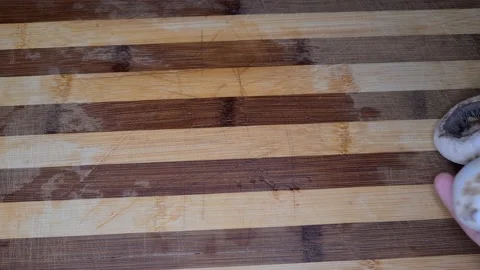 Mushrooms Falling And Rolling On A Table Stockbeeldmateriaal 165542581