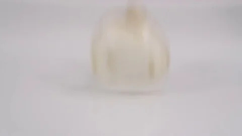 Mushrooms falling on white background into a splash of water Stock Footage 72512476