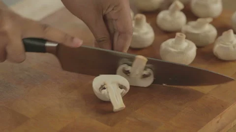 Mushrooms getting sliced. Video stock 42142340