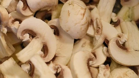 Mushrooms in the process of stewing and frying in a pan in butter Stock Footage 108204700