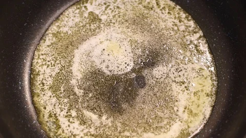 Mushrooms in the process of stewing and frying in a pan in butter Stock-Footage 108204832
