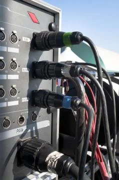 Music cable plug in a central amplifier Stock Photos