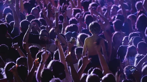 Festival Crowd Holding Lighters in... | Stock | Pond5