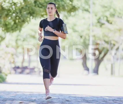 Photograph: Music, fitness or girl running in park training, cardio  exercise or full body #242758327