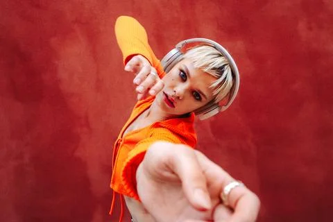 The music flows through her body as she listens through her headphones Stock Photos