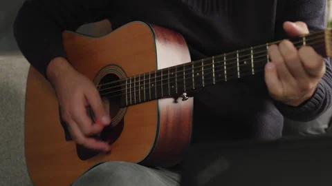 Music hobby and creative expression, person playing acoustic guitar at home Video stock 344143817
