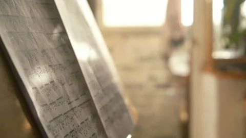 Music notes. home interior cinematic study practicing music Stock Footage 313490706