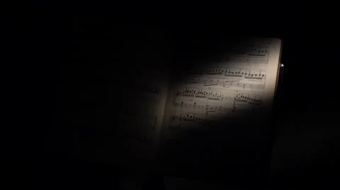 Music notes with ray of light on black Stock Footage 59906422