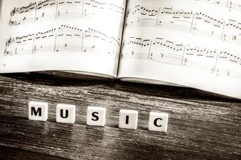 Music notes sheet and letters music Stock Photos