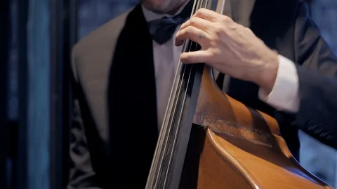 Music playing the cello. Close-up of hands and tools. Stock Footage 121636151